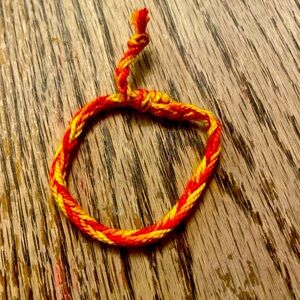 Red orange and yellow braided friendship bracelet